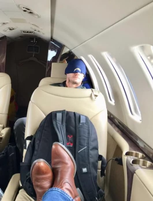Dug Popovich aboard an aircraft during operational travel